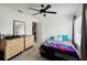 Bright bedroom with neutral walls, modern ceiling fan, and wood-look flooring creating a serene and stylish atmosphere at 8 Lake Jackson Dr, Mascotte, FL 34753
