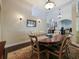 Cozy dining room with chandelier lighting and comfortable seating arrangement at 809 Palmetto Ter, Oviedo, FL 32765