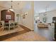 Open-concept home featuring tile flooring, a dining room, and an open living room at 809 Palmetto Ter, Oviedo, FL 32765