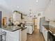 Bright, updated kitchen with granite countertops and modern appliances at 809 Palmetto Ter, Oviedo, FL 32765