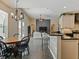 Open-concept kitchen flows into the dining and living area at 809 Palmetto Ter, Oviedo, FL 32765