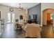 Spacious living room featuring high ceilings, tile flooring, and direct access to the pool at 809 Palmetto Ter, Oviedo, FL 32765