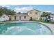 The backyard features a large pool with a jacuzzi, perfect for relaxing and entertaining at 8652 Savory Dr, Orlando, FL 32825