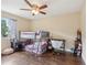 bedroom with hardwood floors and a bunk bed with desk setup at 8652 Savory Dr, Orlando, FL 32825