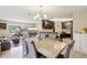 A well-lit dining area seamlessly connects the living room and the kitchen at 8652 Savory Dr, Orlando, FL 32825