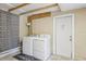 Functional laundry room with a washer, dryer, and tiled flooring at 8652 Savory Dr, Orlando, FL 32825