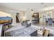 Open concept living room with access to the staircase, kitchen, and dining area at 8652 Savory Dr, Orlando, FL 32825