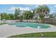Fenced in pool with a beach ball sitting in the pool water and chairs surrounding at 8652 Savory Dr, Orlando, FL 32825