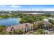 Scenic aerial view of lakeside apartment buildings with views of ICON Park and the Orlando skyline at 8801 Latrec Ave # 8107, Orlando, FL 32819