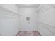 Walk-in closet boasts wire shelving for optimal storage at 8801 Latrec Ave # 8107, Orlando, FL 32819