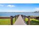 Picturesque dock extending over a serene lake, offering scenic views and access for water activities at 8801 Latrec Ave # 8107, Orlando, FL 32819