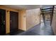 Apartment entrance with dark wood door and black trim plus stairs to upper levels at 8801 Latrec Ave # 8107, Orlando, FL 32819