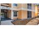 Exterior view of the apartment building showcasing stucco siding and balcony at 8801 Latrec Ave # 8107, Orlando, FL 32819