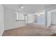 Spacious living room with access to balcony and view of dining area with kitchen at 8801 Latrec Ave # 8107, Orlando, FL 32819