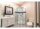 Bathroom featuring tiled shower, sink vanity and patterned tile floor at 911 S Oak Ave, Sanford, FL 32771