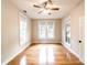 Bedroom with hardwood floors, natural light, and a ceiling fan at 911 S Oak Ave, Sanford, FL 32771