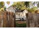 Charming home with landscaped yard, brick patio, and wooden fence at 911 S Oak Ave, Sanford, FL 32771