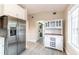 Bright eat-in kitchen featuring stainless steel appliances, cabinetry, and tile flooring at 911 S Oak Ave, Sanford, FL 32771