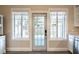 Eat-in kitchen space with a back door and large windows at 911 S Oak Ave, Sanford, FL 32771