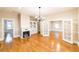 Spacious living room boasts hardwood floors, a fireplace, and an open floor plan at 911 S Oak Ave, Sanford, FL 32771