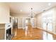 Spacious living room with hardwood floors, a fireplace, and a view of French doors at 911 S Oak Ave, Sanford, FL 32771