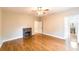 Spacious living room with hardwood floors, fireplace, and natural light at 911 S Oak Ave, Sanford, FL 32771