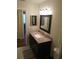 Renovated bathroom with a new vanity, granite countertop, and modern fixtures at 943 Millenbeck Ave, Deltona, FL 32725
