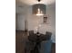 Cozy dining area with a modern chandelier, seating for four, and contemporary wall art at 943 Millenbeck Ave, Deltona, FL 32725