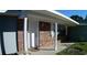 Exterior showcasing the red brick, neutral siding, white door, and landscaped front yard at 943 Millenbeck Ave, Deltona, FL 32725