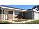 Charming single-story home featuring a brick facade, white trim, and a well-maintained front lawn at 943 Millenbeck Ave, Deltona, FL 32725