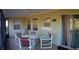 Relaxing screened-in patio includes a table and chairs, perfect for outdoor dining and entertaining at 943 Millenbeck Ave, Deltona, FL 32725