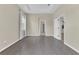 Spacious bedroom featuring tray ceiling, wood-look floors, and abundant natural light at 10417 Oakview Pointe Ter, Gotha, FL 34734