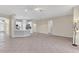 Spacious open concept living space with tile flooring, a kitchen with stainless appliances, and neutral wall color at 10417 Oakview Pointe Ter, Gotha, FL 34734