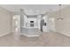 Open concept living space featuring white kitchen, stainless appliances, and a dining area at 10417 Oakview Pointe Ter, Gotha, FL 34734