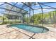 Screened-in pool area with lush landscaping and a brick-paved patio at 10417 Oakview Pointe Ter, Gotha, FL 34734