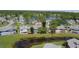 Overhead view of the community showcasing the surrounding pond and mature tree coverage at 105 Wood Duck Cir # D, Daytona Beach, FL 32119
