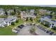 Aerial view of the townhome complex, showcasing well-maintained landscaping and nearby pond views at 105 Wood Duck Cir # D, Daytona Beach, FL 32119