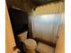 Practical bathroom featuring a toilet, cabinet, and shower at 105 Wood Duck Cir # D, Daytona Beach, FL 32119
