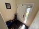 Inviting entryway with hardwood floors, a large front door, and natural light at 105 Wood Duck Cir # D, Daytona Beach, FL 32119