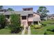 Delightful townhome showcasing a welcoming entrance, attractive landscaping, and serene surroundings at 105 Wood Duck Cir # D, Daytona Beach, FL 32119