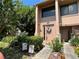 Inviting townhome entrance with manicured garden, patriotic decor, and neutral tones at 105 Wood Duck Cir # D, Daytona Beach, FL 32119