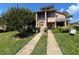 Charming townhome featuring manicured landscaping, a private entrance, and a peaceful residential setting at 105 Wood Duck Cir # D, Daytona Beach, FL 32119