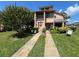 Charming townhome featuring manicured landscaping, a private entrance, and a peaceful residential setting at 105 Wood Duck Cir # D, Daytona Beach, FL 32119