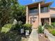 Charming two-story townhome with a welcoming front entrance and well-maintained landscaping at 105 Wood Duck Cir # D, Daytona Beach, FL 32119
