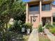 Charming townhome featuring a landscaped front yard and a welcoming entrance at 105 Wood Duck Cir # D, Daytona Beach, FL 32119