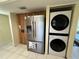 Kitchen features stainless steel appliances, ample cabinets, granite countertops, and tile flooring at 105 Wood Duck Cir # D, Daytona Beach, FL 32119