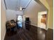 Bright living room with wood floors, vaulted ceiling, and access to the kitchen area at 105 Wood Duck Cir # D, Daytona Beach, FL 32119