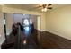 Open floor plan showcasing hardwood floors and view of a second living room at 105 Wood Duck Cir # D, Daytona Beach, FL 32119