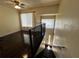 Bright living room featuring hardwood floors, large windows, and an open staircase at 105 Wood Duck Cir # D, Daytona Beach, FL 32119