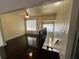 Open floor plan featuring stairs down to the entryway and an inviting living room with ample natural light at 105 Wood Duck Cir # D, Daytona Beach, FL 32119